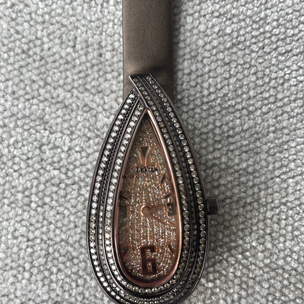 Chocolate Diamonds Le Vian watchThe brown leather strap secures with a buckle